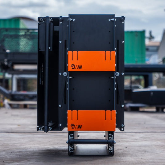 Front Folded view of the DMW Compact Kitchen and Pantry system, showcasing the vertical dual-compartment design with signature orange retaining panels and precision-cut mounting frame. Ideal for canopy fit-outs requiring rugged, space-saving kitchen storage.