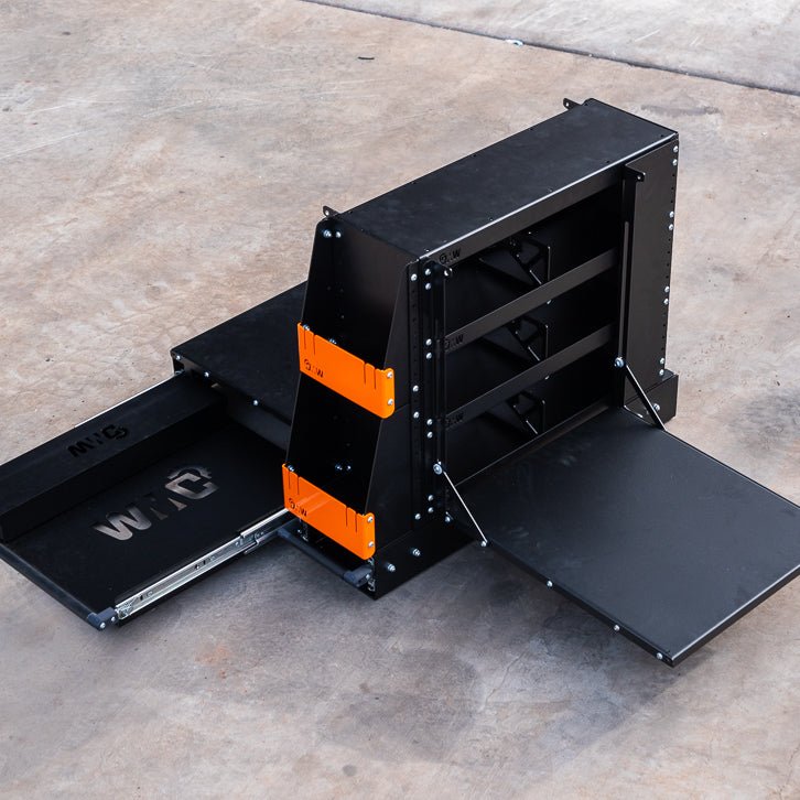 Load image into Gallery viewer, Top-down view of the DMW Compact Kitchen and Pantry in its fully deployed state, displaying the fold-out bench surfaces and sliding drawer system. Designed for efficient use of space in 4WD canopies and touring setups, with distinctive orange bracket accents.
