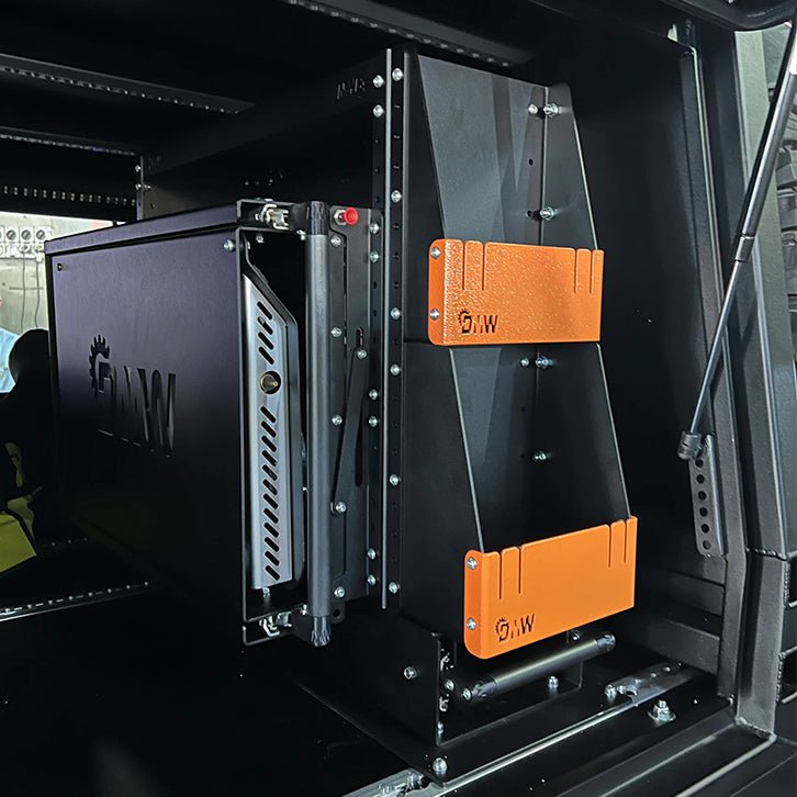 Load image into Gallery viewer, Close-up view of a DMW Slide-Out Kitchen and Pantry system system installed inside a canopy, featuring laser-cut branding, heavy-duty slide rails, and signature orange powder-coated end brackets. 
