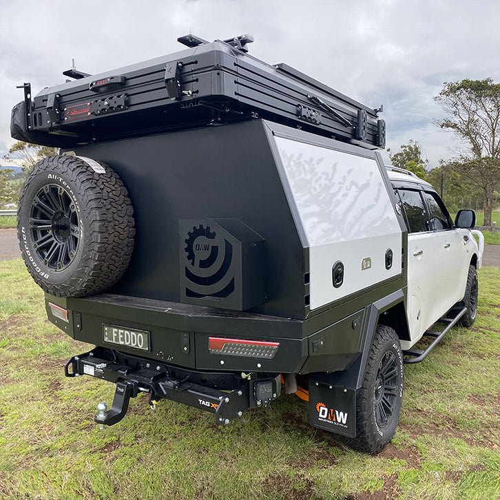 Three-quarter rear view of XTR Tray and Canopy on a dual cab Y62 Patrol conversion, showcasing rugged styling and integrated storage.